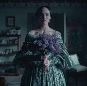 Elegant Green Dress with Purple Floral Bouquet